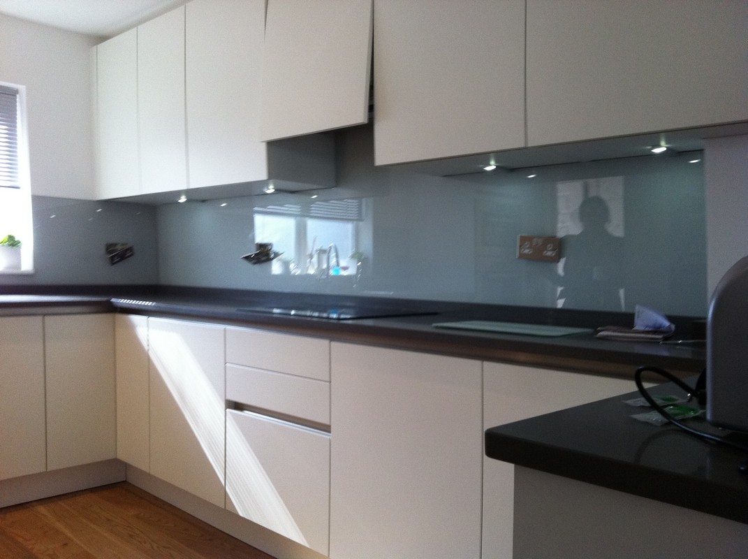 Grey glass kitchen splashback with LED lighting in Northwood
