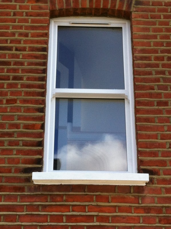 uPVC sash window on Victorian red brick house in Northwood